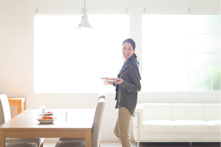 A woman, a table and some chair